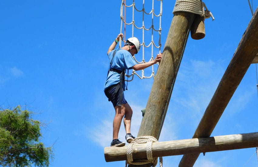 Photo: Camp participant on a climbing tower