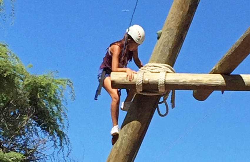 Photo: Camp participant on the climbing tower