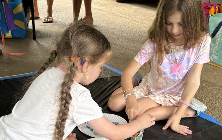 Photo: Students painting at Art in the Park